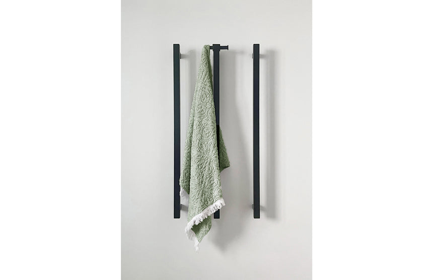 Phoenix Heated Triple Towel Rail Square 800mm Matte Black, shown in a finished interior