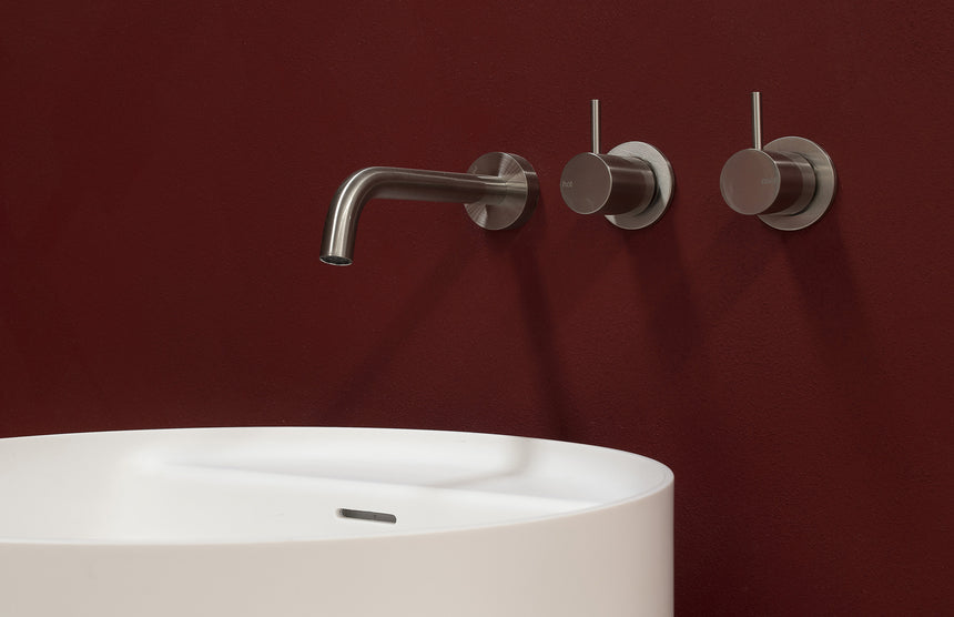 Phoenix Vivid Slimline Plus Wall Basin / Bath Outlet 180mm Brushed Nickel, shown in a finished interior