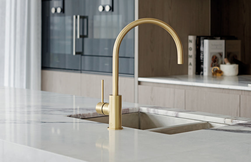 Phoenix Vivid Slimline Sink Mixer 220mm Gooseneck Brushed Gold, shown in a finished interior