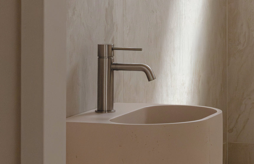 Phoenix Vivid Slimline Basin Mixer Curved Outlet Brushed Nickel, shown in a finished interior
