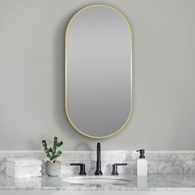 Oval 500x1000mm Lamex framed mirror by Tilemall with brushed yellow gold frame, wall-mounted above marble vanity
